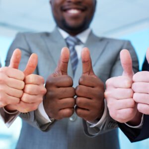 Three business partners keeping thumbs up