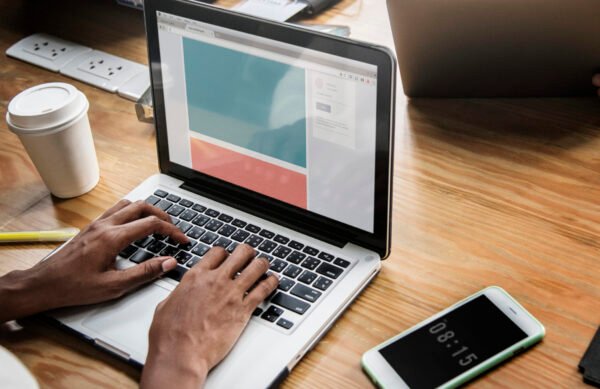 People working on a laptop in a meeting